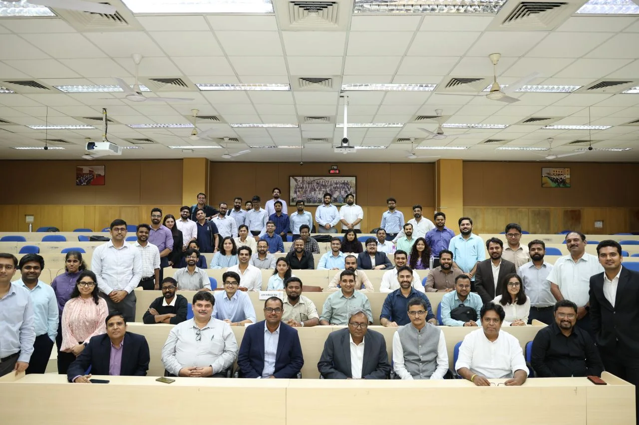 Group photograph of the Odyssey event attendees in an IIM Indore lecture hall.