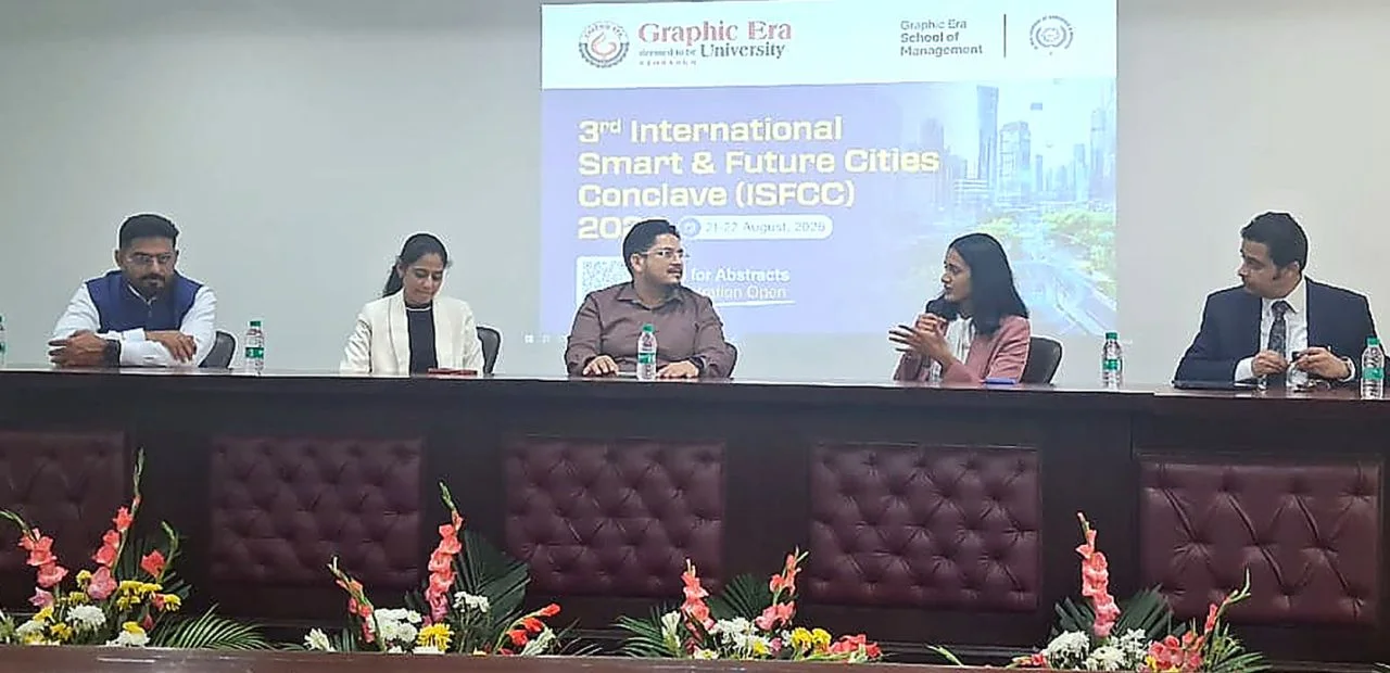 Panel discussion at the 3rd International Smart & Future Cities Conclave, with speakers seated on stage.